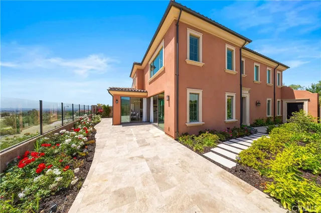 a dining room with furniture a chandelier and a rug