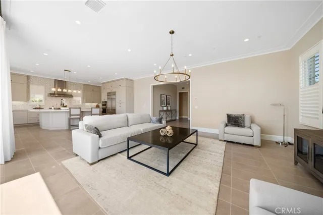 a bedroom with a large bed and a couch