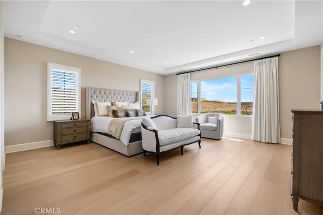 a dining room with furniture and a window