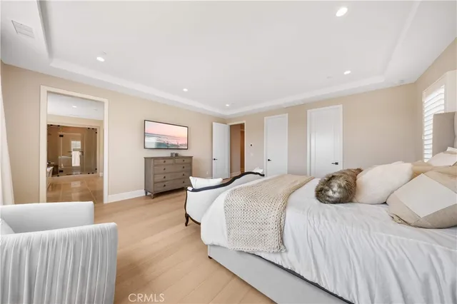 a living room with patio furniture and a potted plant