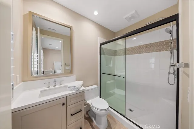 a view of a lake with houses in the back