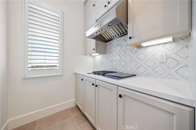 a view of a hallway with wooden floor and stairs
