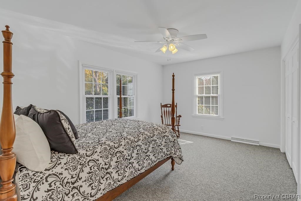1057 Monaskon Road Lancaster, VA 22503 - Photo 14 of 43 Bedroom featuring ceiling fan and carpet floors