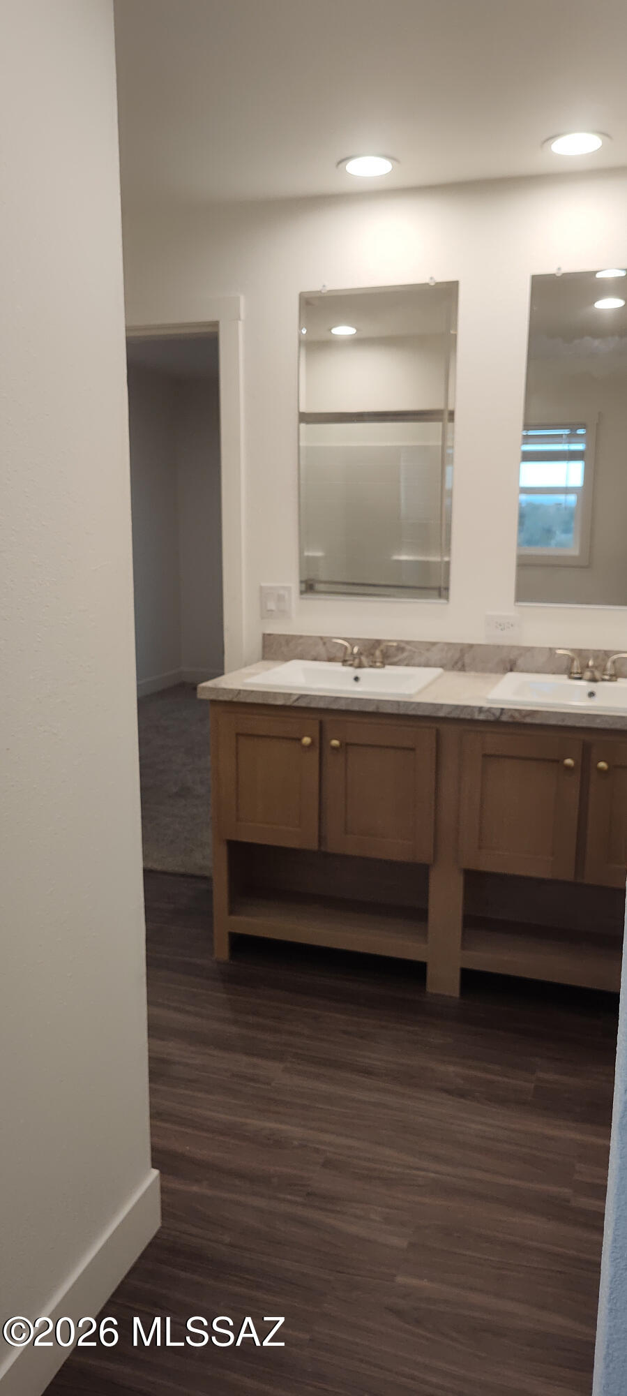 18565 West McClean Road Marana, AZ 85653 - Photo 18 of 37 a bathroom with a sink and a mirror