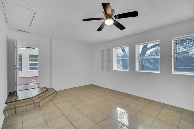 a view of empty room with windows