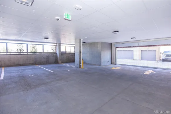 a view of empty room with window and pillar area