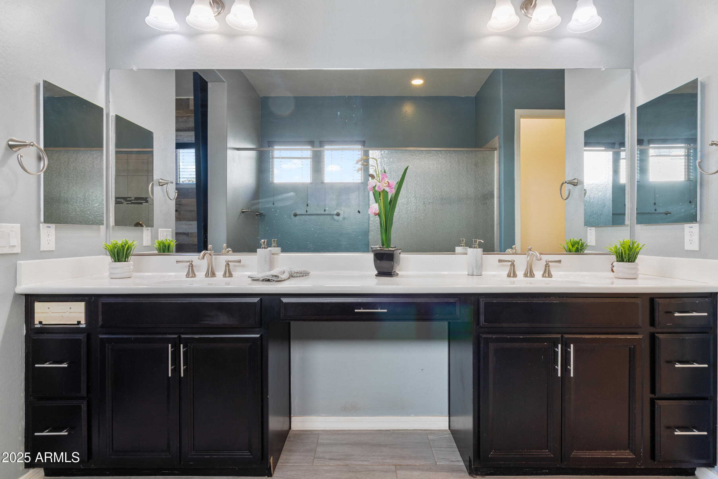 2365 North Springfield Street Buckeye, AZ 85396 - Photo 13 of 30 a bathroom with a sink and a mirror
