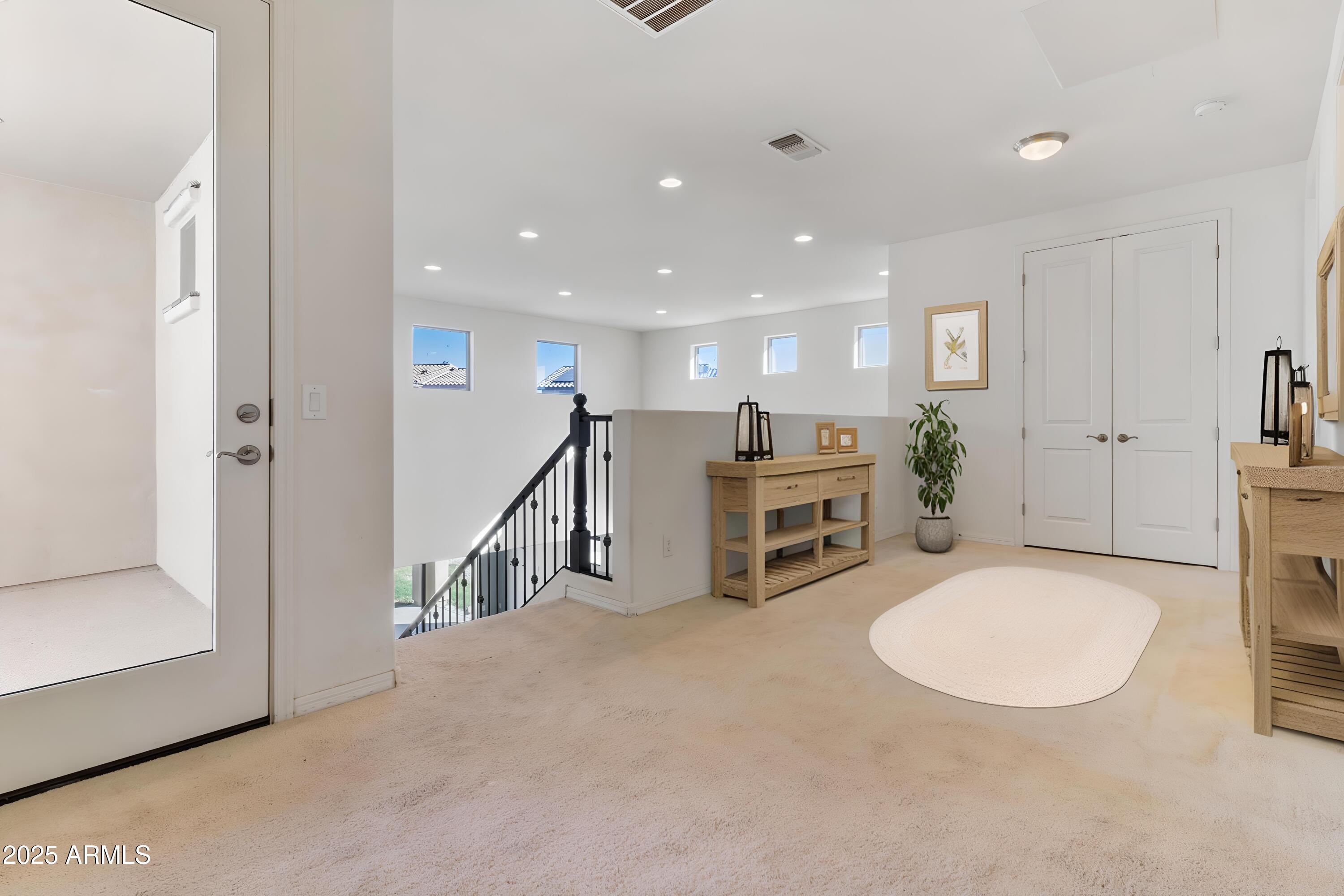 2365 North Springfield Street Buckeye, AZ 85396 - Photo 15 of 30 a view of a livingroom with furniture and staircase
