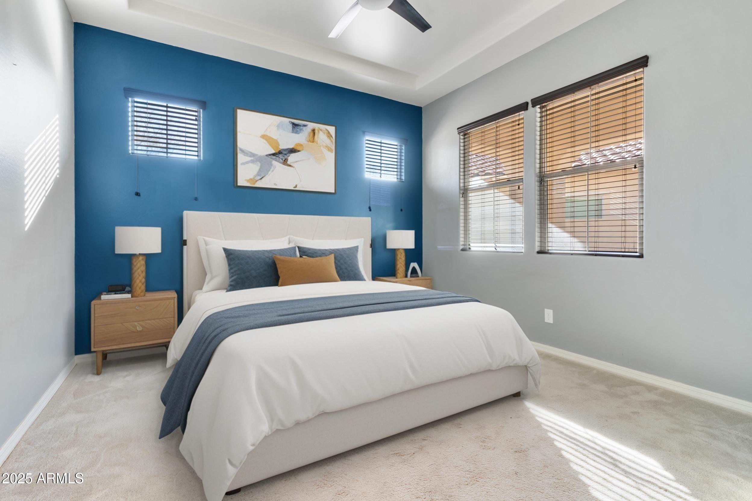 2365 North Springfield Street Buckeye, AZ 85396 - Photo 22 of 30 a bedroom with a bed and a painting on the wall