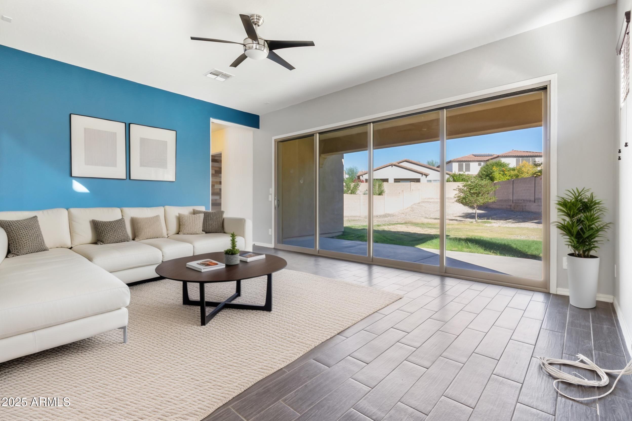 2365 North Springfield Street Buckeye, AZ 85396 - Photo 8 of 30 a living room with couch
