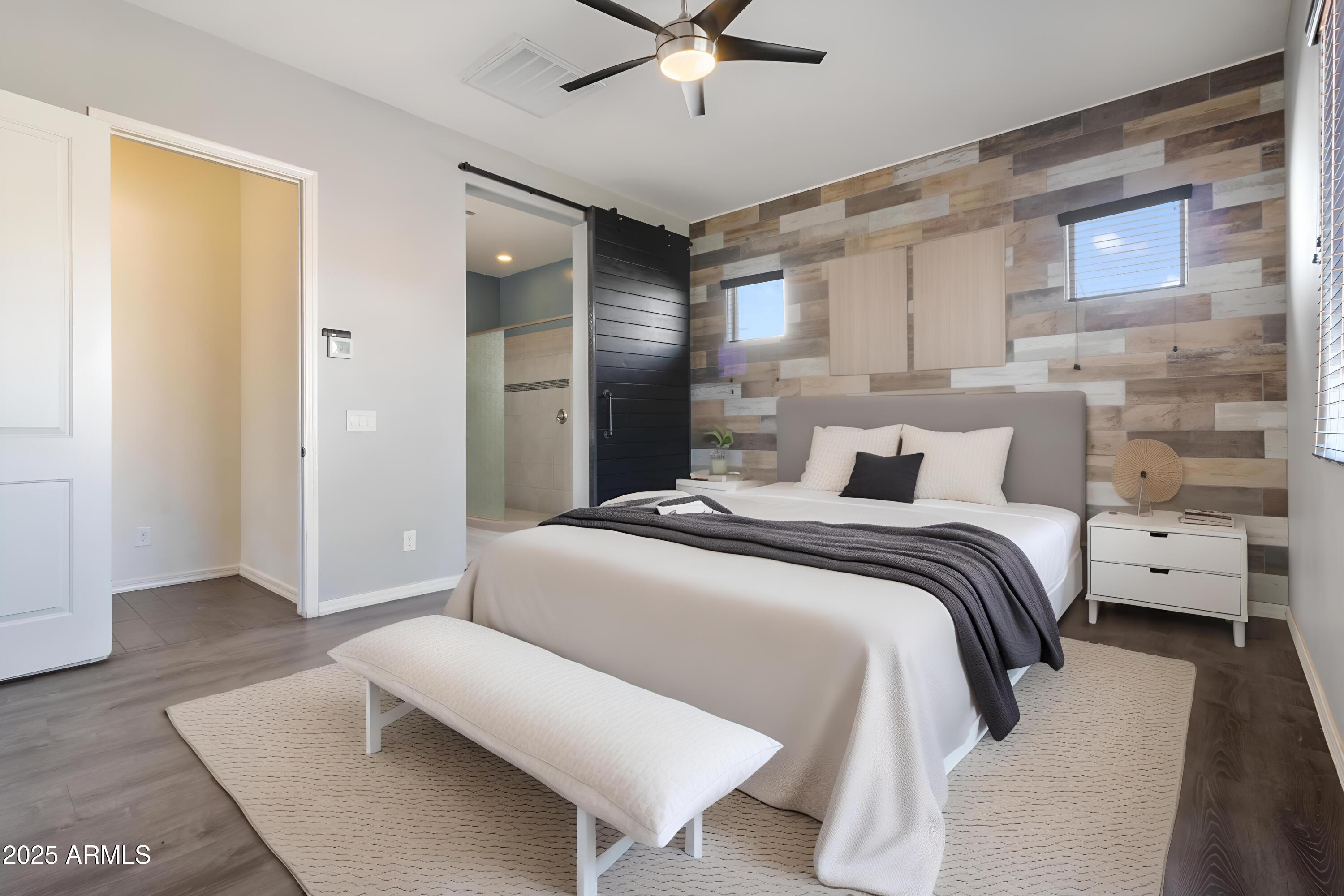 2365 North Springfield Street Buckeye, AZ 85396 - Photo 10 of 30 a bedroom with a bed and a ceiling fan