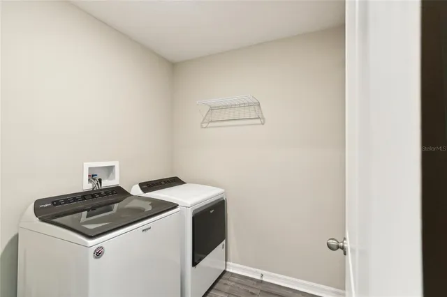 a utility room with dryer and washer