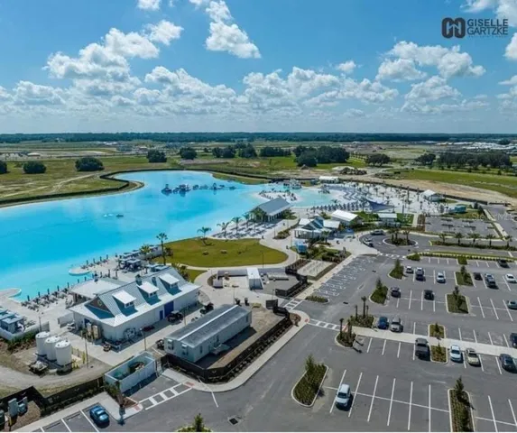 an aerial view of a city with lawn chairs
