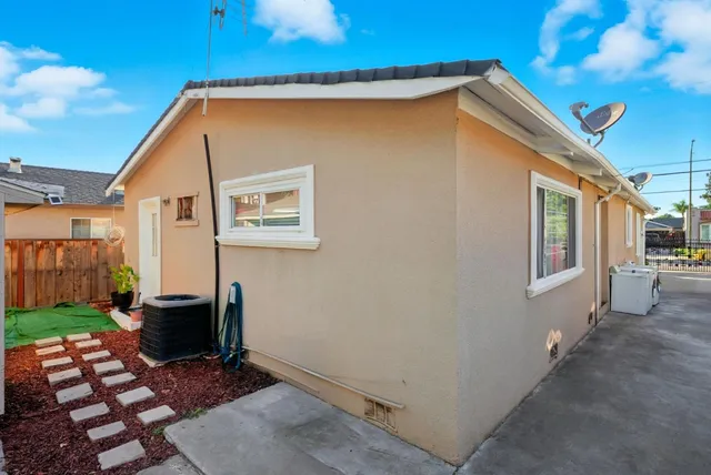 a backyard of a house with seating space
