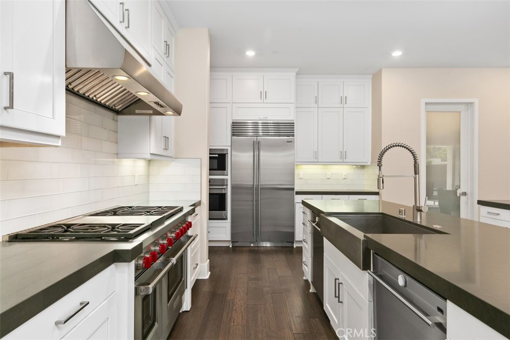79 Gravity Irvine, CA 92618 - Photo 13 of 70 a kitchen with stainless steel appliances granite countertop a sink stove and refrigerator