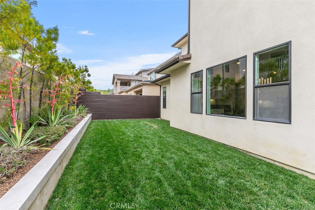 79 Gravity Irvine, CA 92618 - Photo 20 of 70 a front view of a house with a yard