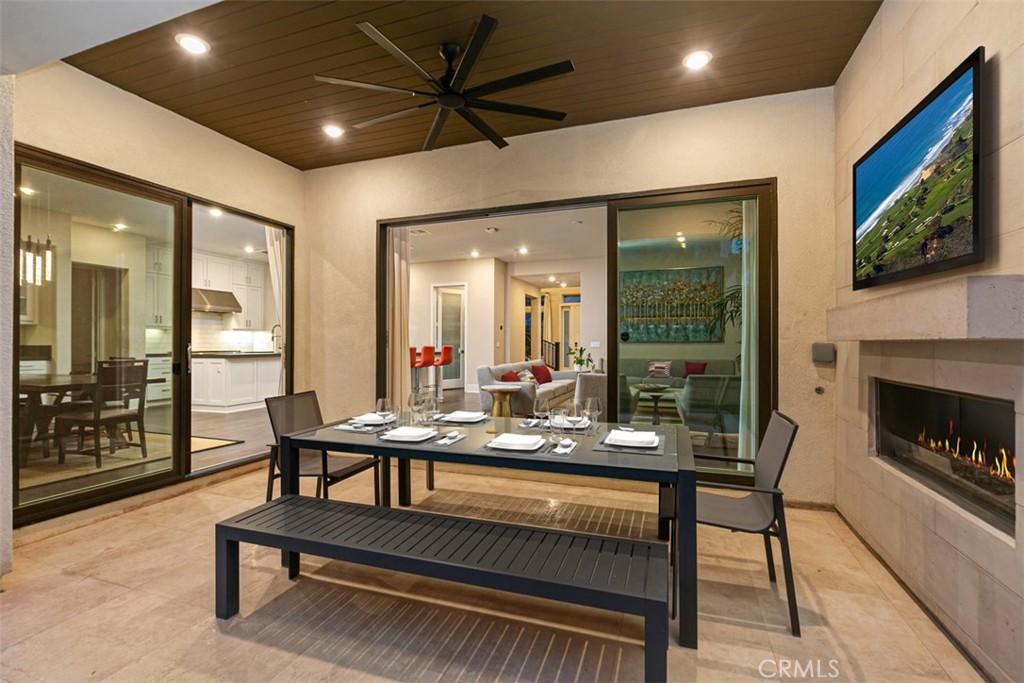 79 Gravity Irvine, CA 92618 - Photo 23 of 70 a dining room with furniture and a fireplace
