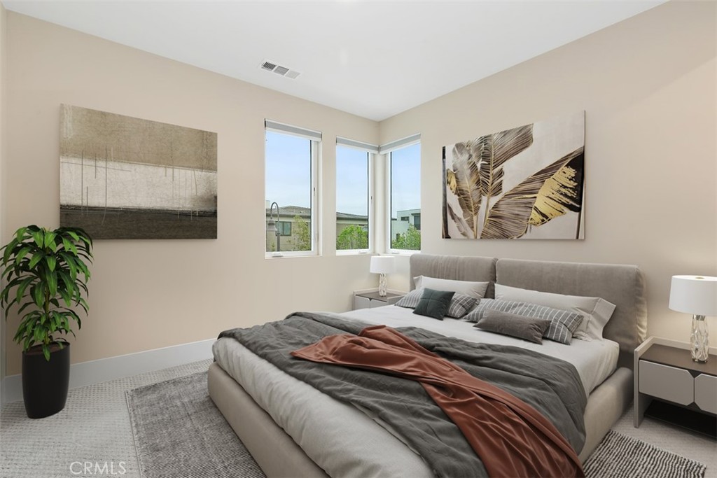 79 Gravity Irvine, CA 92618 - Photo 39 of 70 a bedroom with bed and a potted plant