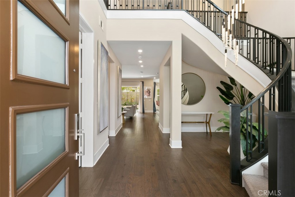 79 Gravity Irvine, CA 92618 - Photo 4 of 70 a view of entryway and hall with wooden floor