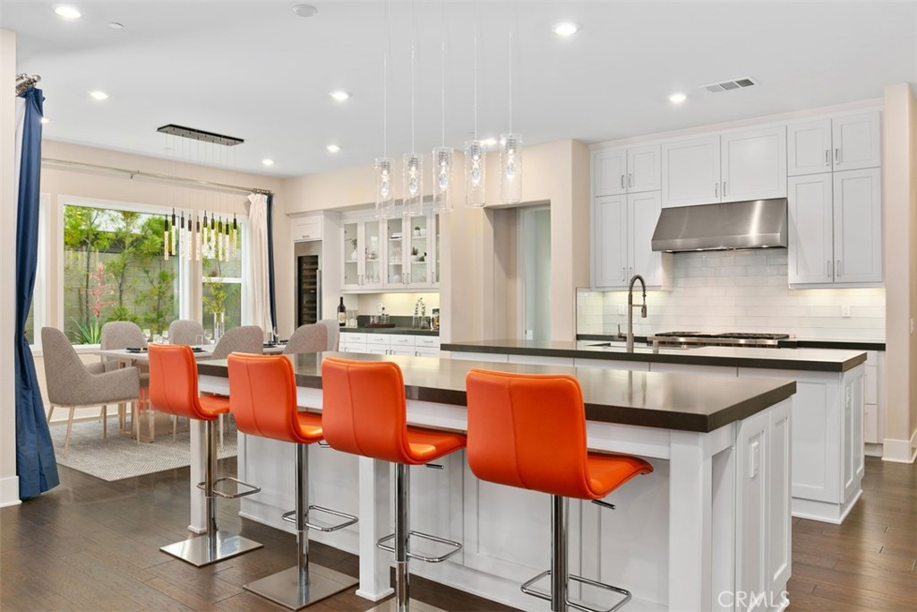 79 Gravity Irvine, CA 92618 - Photo 8 of 70 a kitchen with stainless steel appliances granite countertop a stove a sink and a refrigerator