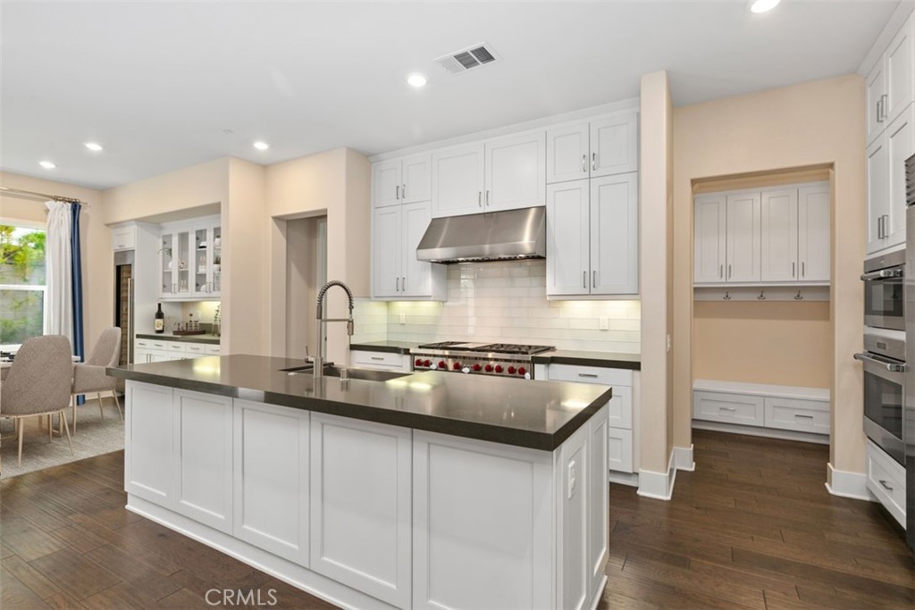 79 Gravity Irvine, CA 92618 - Photo 9 of 70 a kitchen with stainless steel appliances granite countertop a sink stove and refrigerator