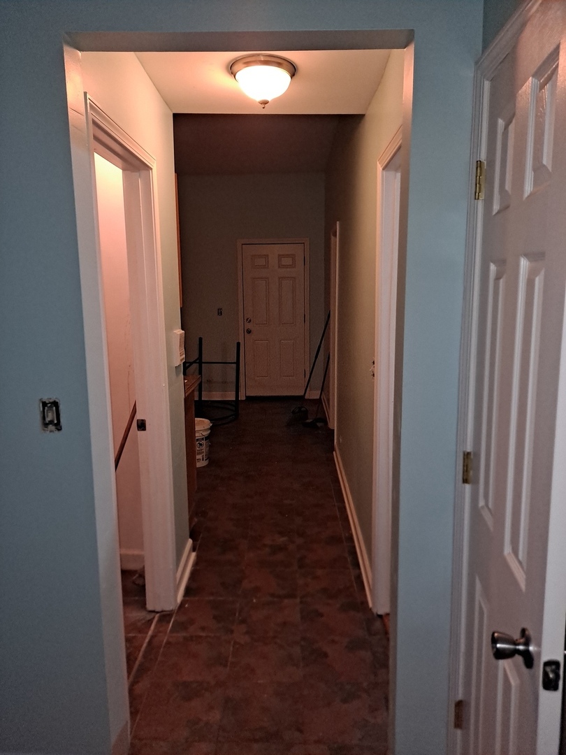 1640 South Springfield Avenue Chicago, IL 60623 - Photo 2 of 11 a view of a hallway with a wooden door