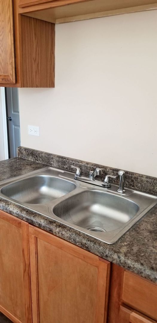 1640 South Springfield Avenue Chicago, IL 60623 - Photo 10 of 11 a view closed with granite countertop a sink