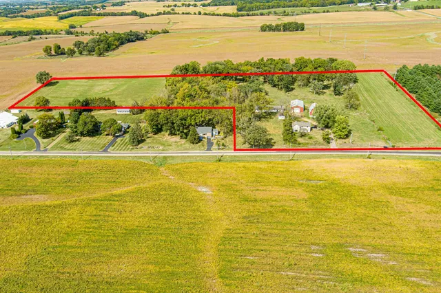 a view of room with floor to ceiling window and wooden floor