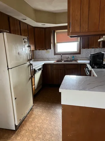 a room with wooden floor and windows
