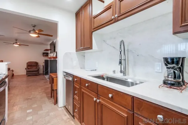 a kitchen with a sink and cabinets
