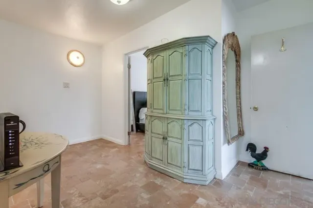 a view of a storage and utility room with closet