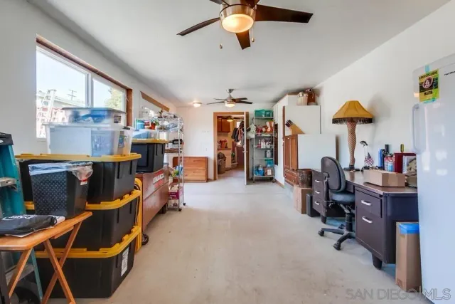 a living room filled with furniture and a chandelier