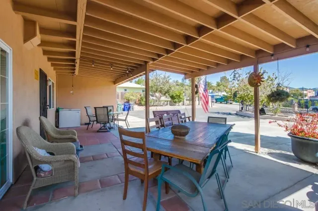 a view of backyard with outdoor seating