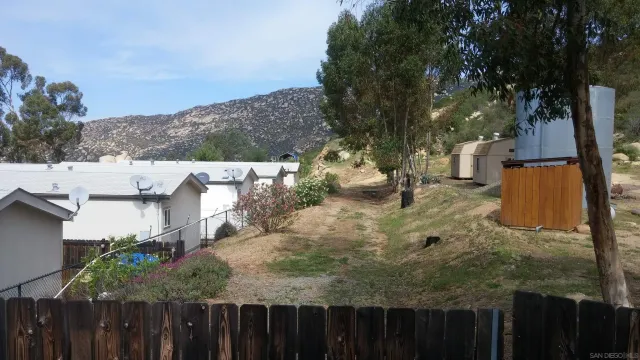 a kitchen with stainless steel appliances a refrigerator and a stove top oven
