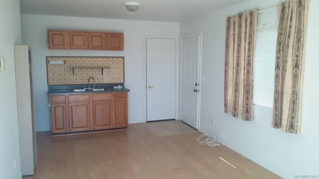 a view of a yard with large trees