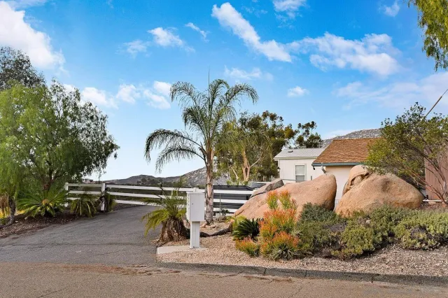 a view of a garden with sitting area