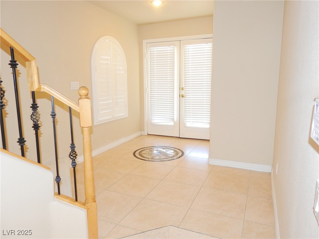 2428 Devotion Ridge Drive Henderson, NV 89052 - Photo 5 of 31 french doors, and healthy amount of natural light
