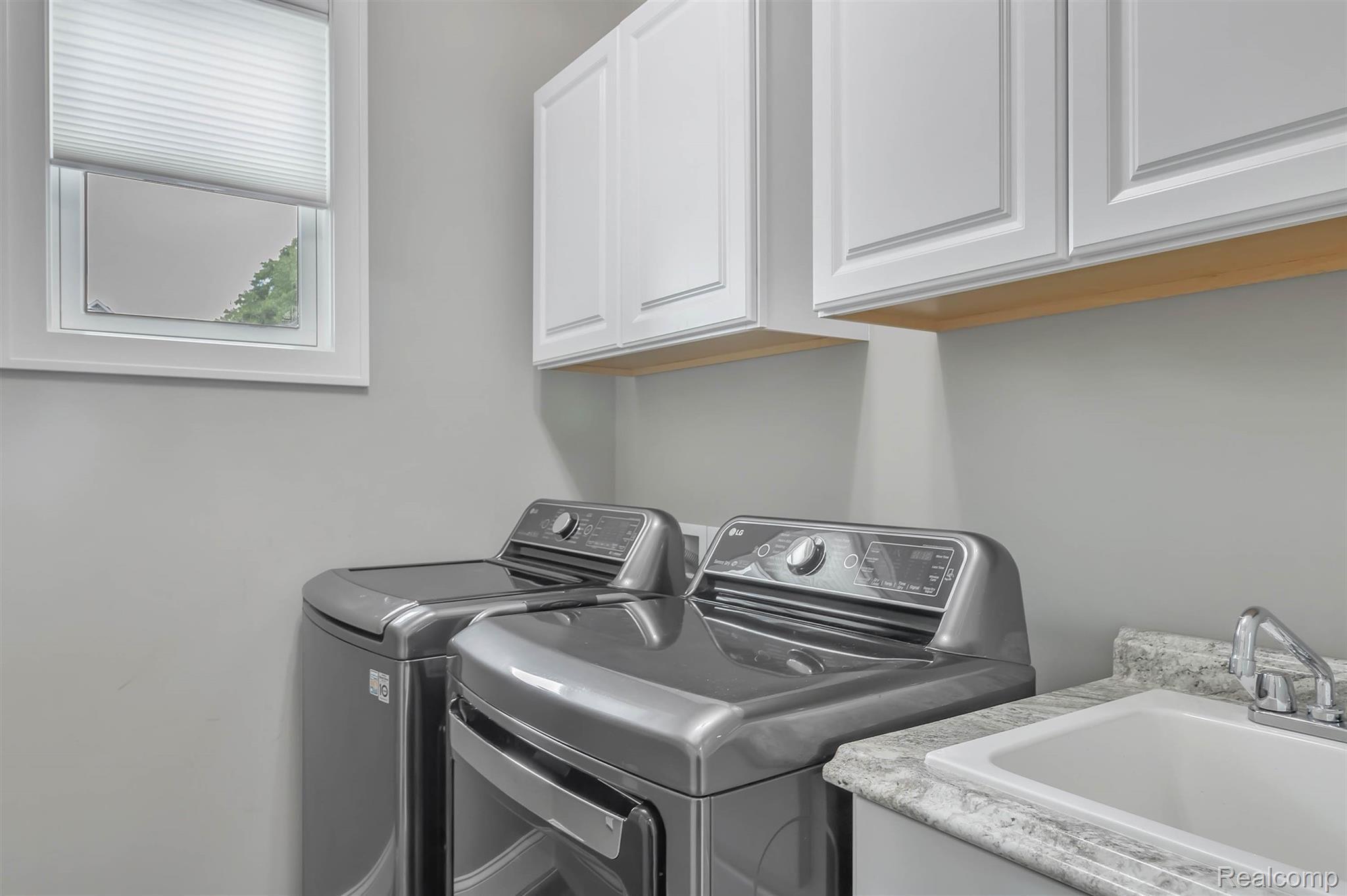 860 North Hacker Road Howell, MI 48843 - Photo 27 of 53 First Floor Laundry, Natural Lighting, Soaker Sink