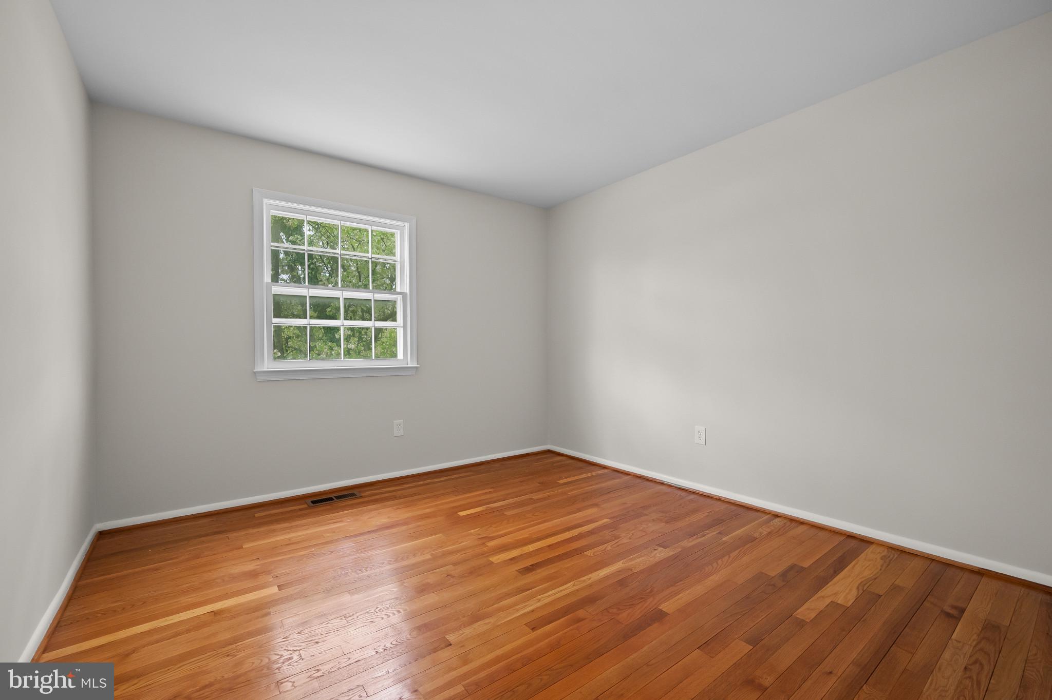 19420 Olney Mill Road Olney, MD 20832 - Photo 14 of 44 an empty room with wooden floor and windows