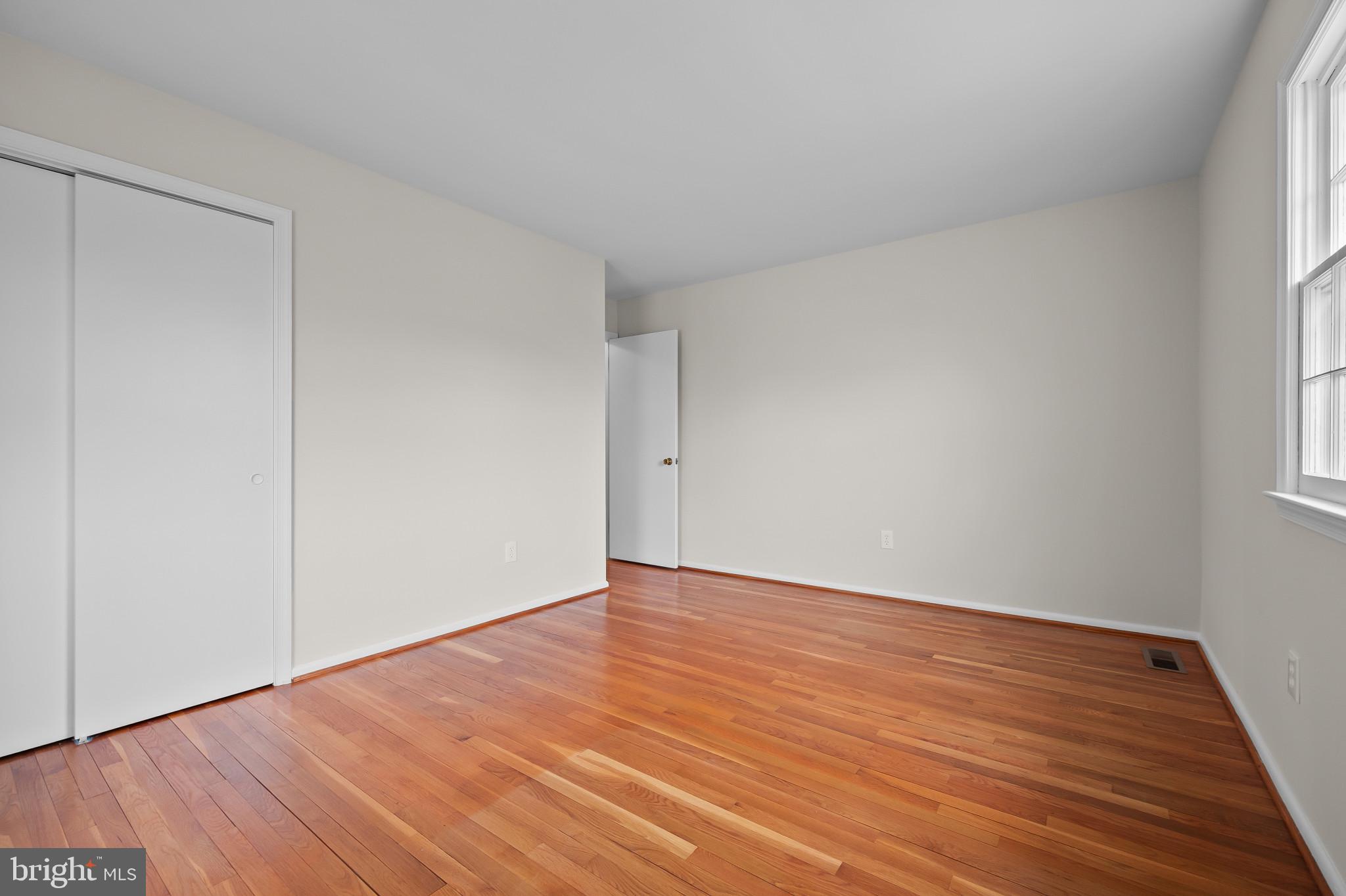 19420 Olney Mill Road Olney, MD 20832 - Photo 15 of 44 a view of an empty room with wooden floor and a window
