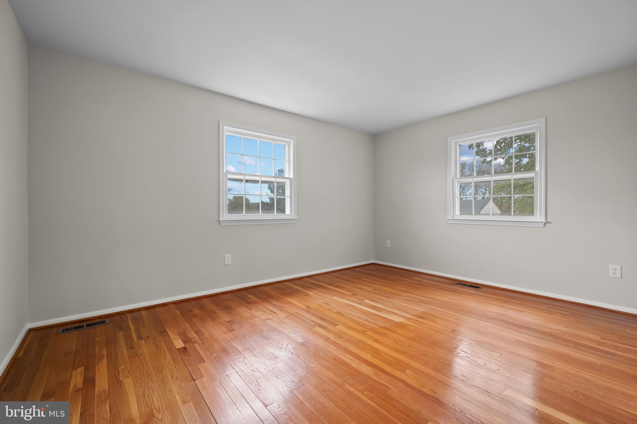 19420 Olney Mill Road Olney, MD 20832 - Photo 17 of 44 a view of an empty room with wooden floor and a window