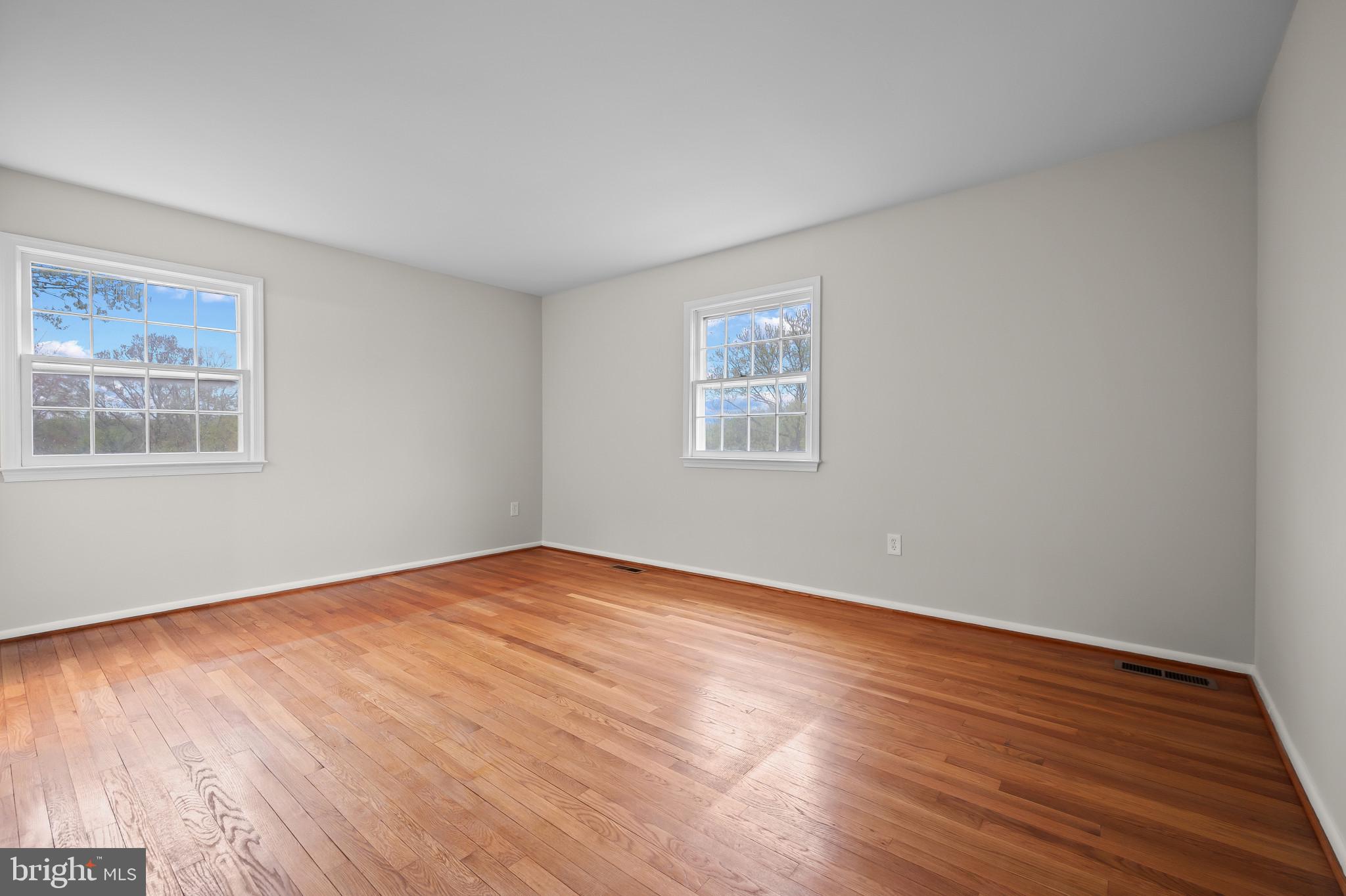 19420 Olney Mill Road Olney, MD 20832 - Photo 18 of 44 a view of an empty room with wooden floor and a window