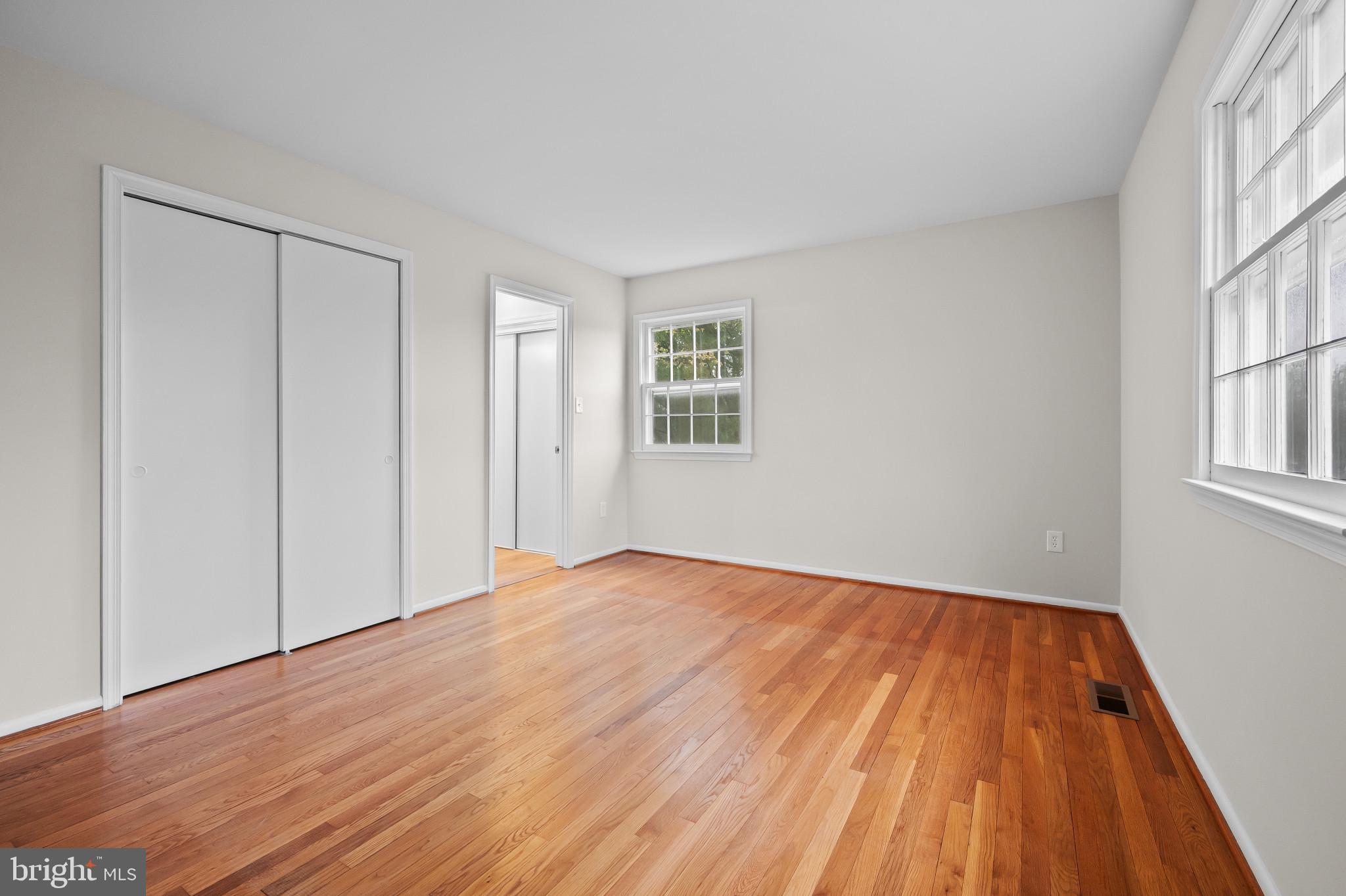 19420 Olney Mill Road Olney, MD 20832 - Photo 19 of 44 a view of an empty room with wooden floor and a window