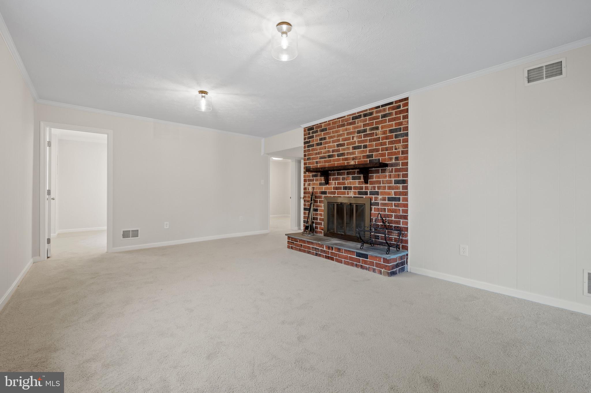 19420 Olney Mill Road Olney, MD 20832 - Photo 23 of 44 an empty room with a fireplace and window