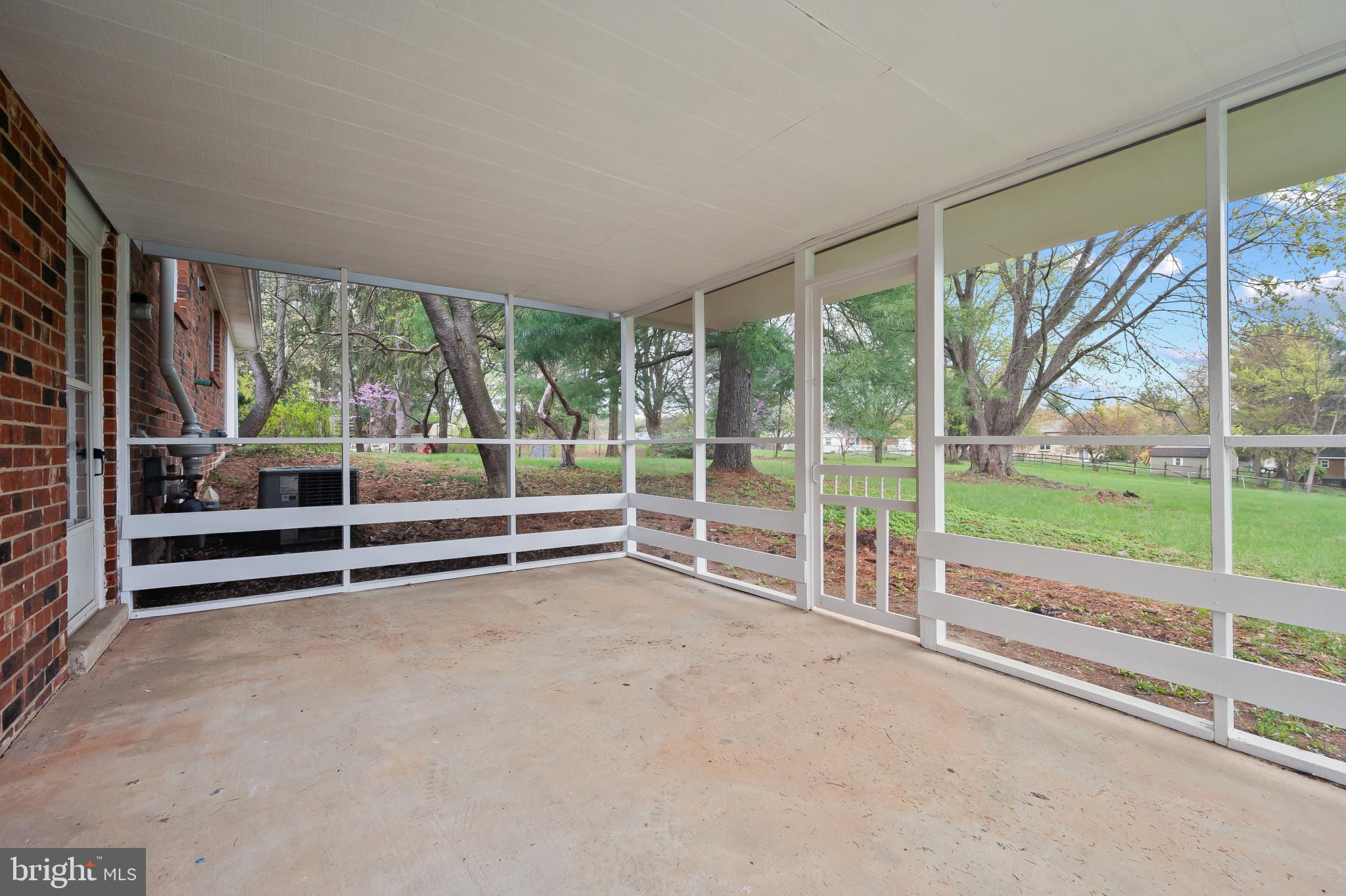 19420 Olney Mill Road Olney, MD 20832 - Photo 33 of 44 a view of an empty room with wooden floor and balcony