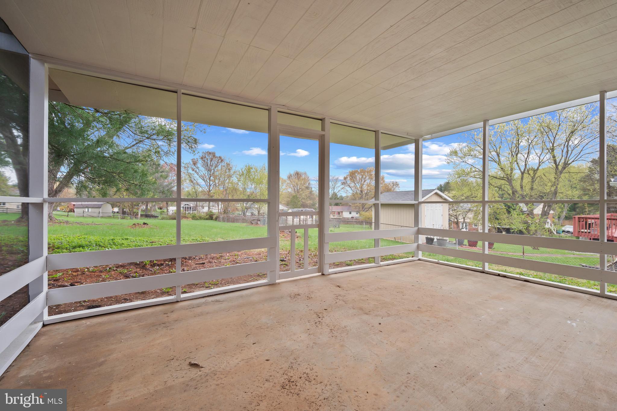 19420 Olney Mill Road Olney, MD 20832 - Photo 35 of 44 a view of an empty room with a floor to ceiling window