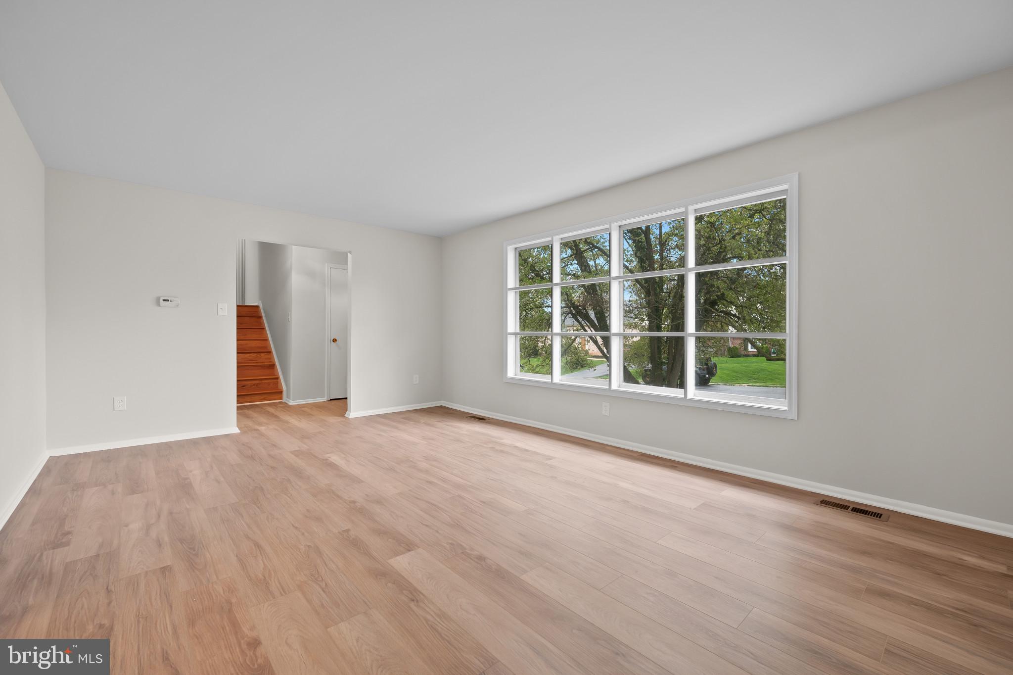 19420 Olney Mill Road Olney, MD 20832 - Photo 5 of 44 wooden floor in an empty room with a window