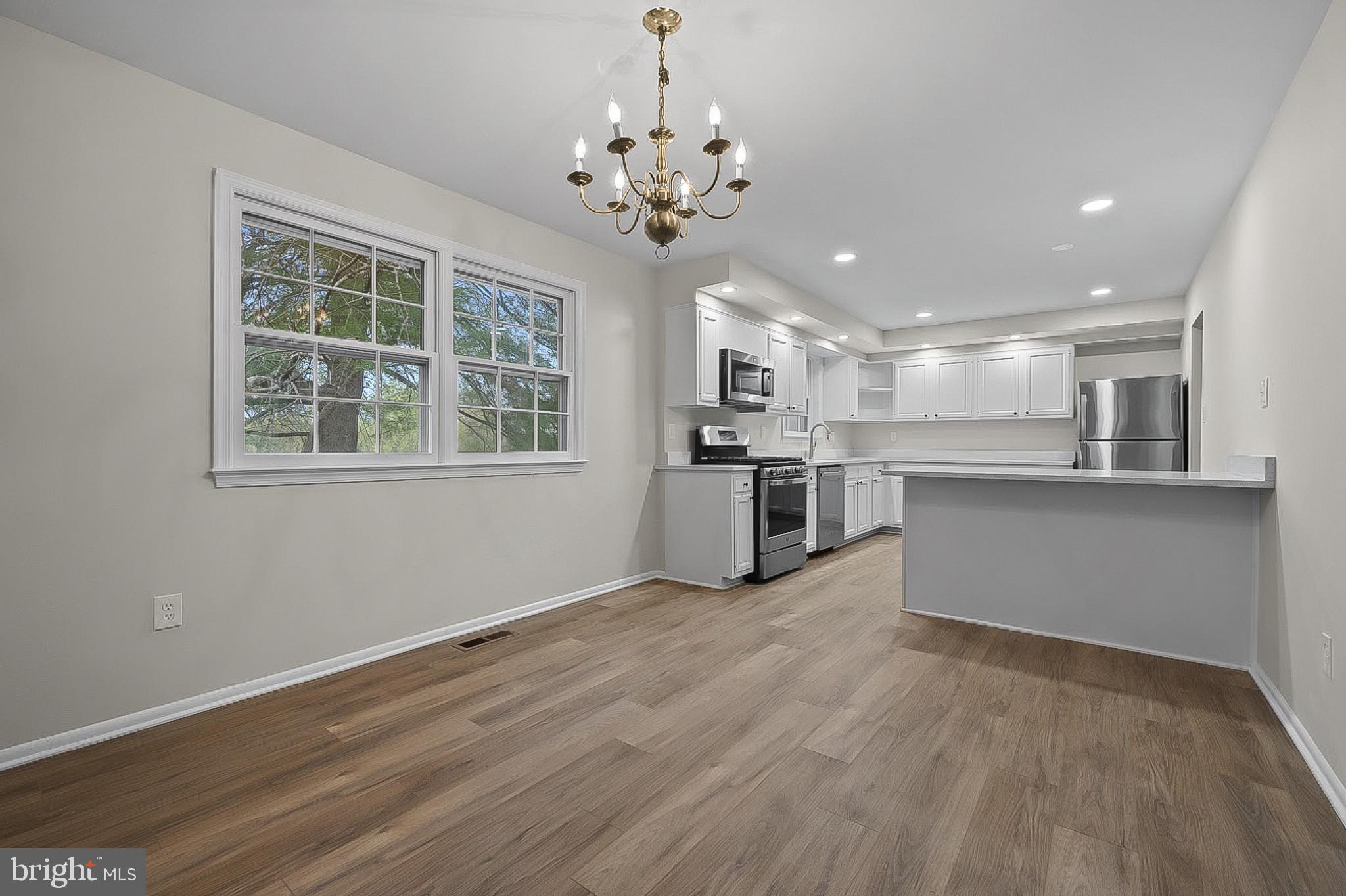 19420 Olney Mill Road Olney, MD 20832 - Photo 7 of 44 a view of a kitchen with a sink a refrigerator and window