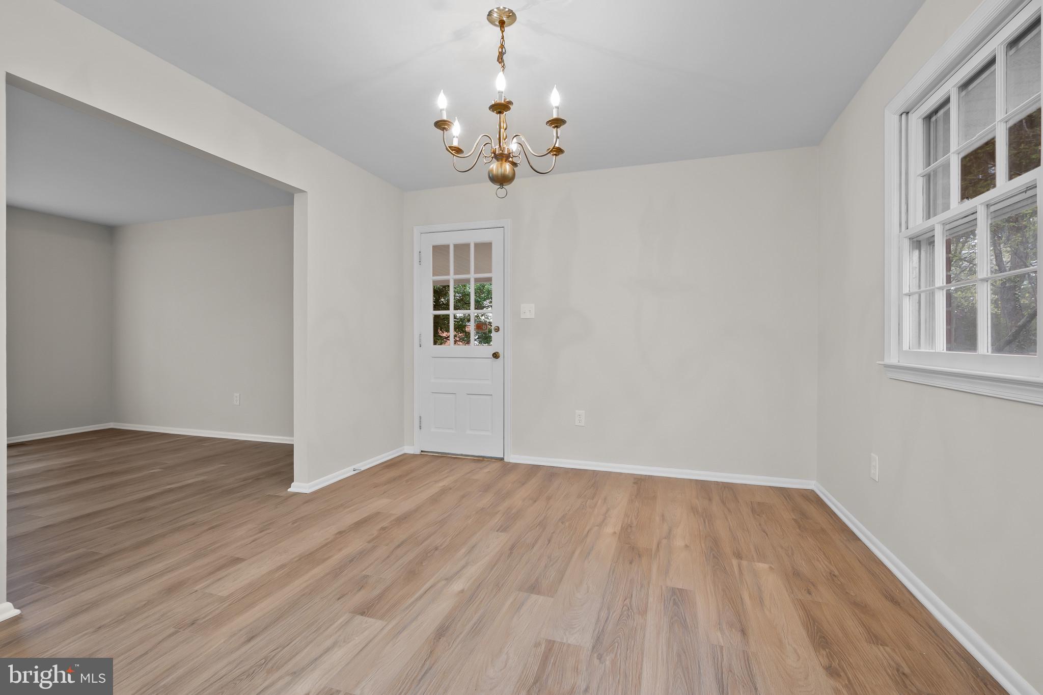 19420 Olney Mill Road Olney, MD 20832 - Photo 8 of 44 a view of livingroom with chandelier and wooden floor