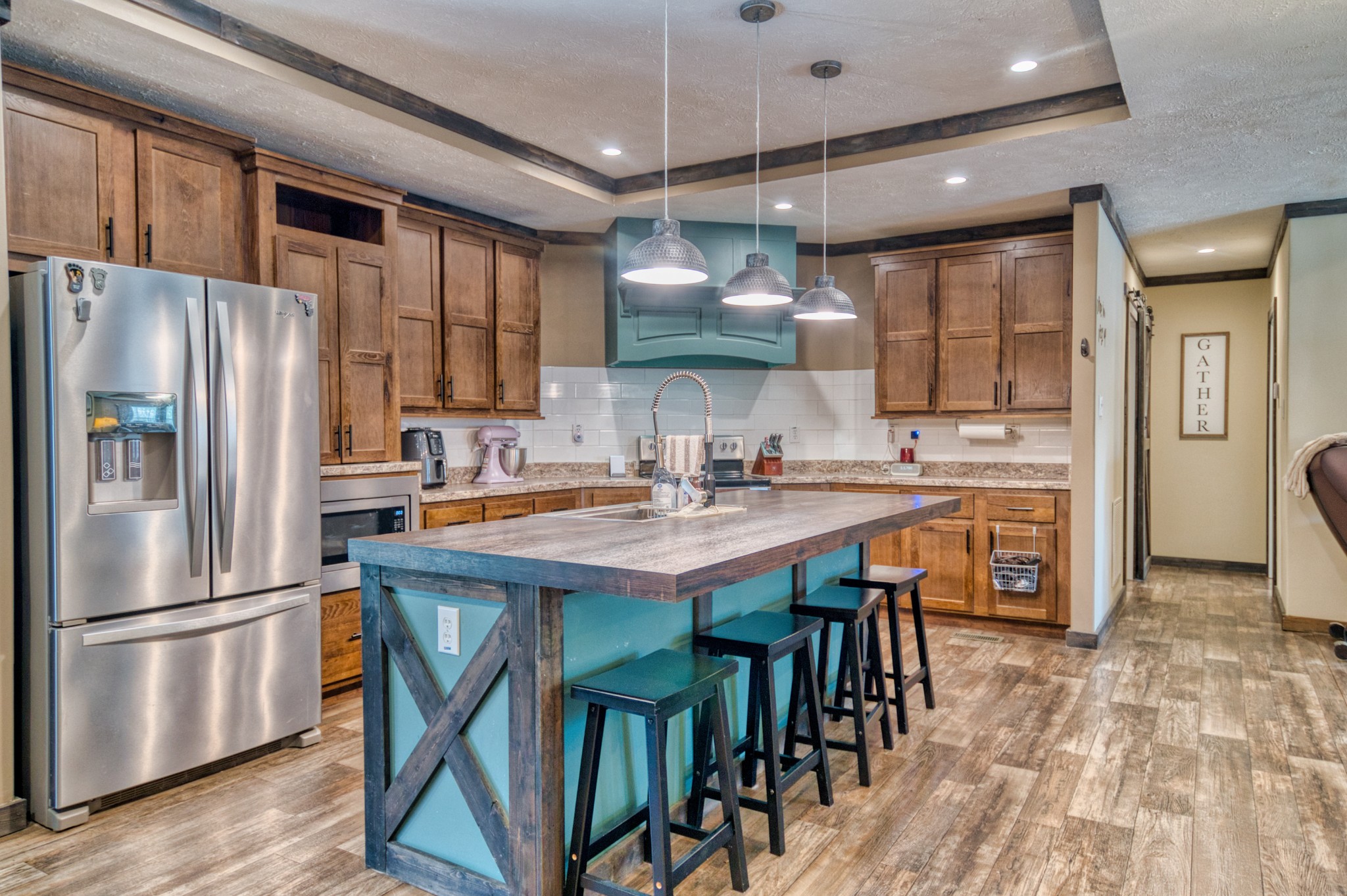 721 Spa Road Lewisburg, KY 42256 - Photo 29 of 56 a kitchen with stainless steel appliances granite countertop a refrigerator a sink dishwasher a stove and a refrigerator with wooden floor